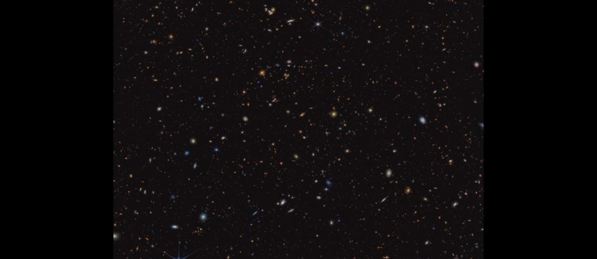 45,000 orange, yellow, and white galaxies sit in an inky black void, as seen through the James Webb Space Telescope.