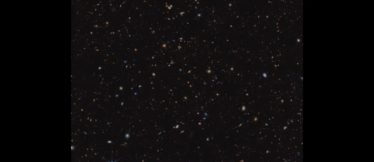 45,000 orange, yellow, and white galaxies sit in an inky black void, as seen through the James Webb Space Telescope.